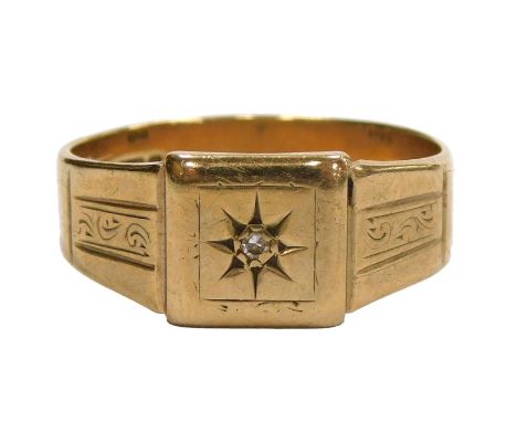 A 9ct gold and diamond set signet ring, in a star setting, with engraved shoulders, size V, 4.2g.