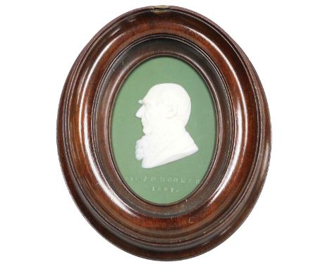 A late 19thC green Jasperware plaque, showing a bust portrait of Sir Joseph Dalton Hooker 1897, framed, 9.5cm x 6.5cm.