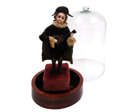 A late 19thC Tete Jumeau musical automaton, possibly designed by Leopold Lambert, modelled as a boy standing wearing black ve
