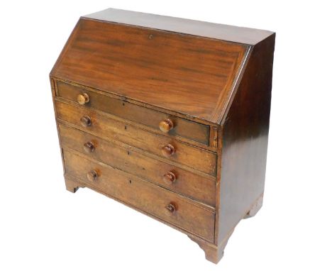 An early 29thC mahogany bureau, the fall enclosing a fitted interior, above four graduated drawers, with later turned handles