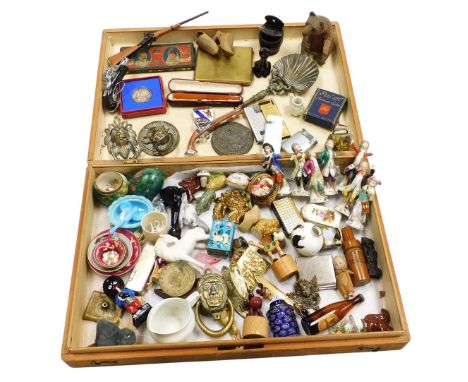 A box of collectables and curios, including glassware, porcelain scent bottles, Wade whimsies, coins, pocket lighters, a silv