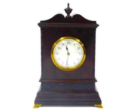 An early 20thC mahogany cased mantel clock, circular enamel dial bearing Arabic numerals, French clockwork movement, the case