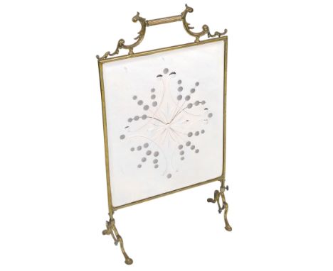 A Victorian brass fire screen, with a rectangular mirrored plate, engraved and etched with a floral geometric pattern, raised