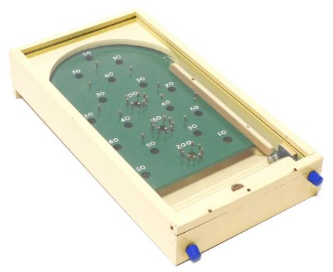 An early 20thC Chad Valley Bagatelle game, boxed.