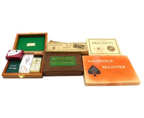 A late 19thC John Jacques game of pontoon, containing white and red stained bone markers, boxed with instructions, St George 