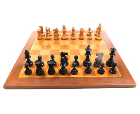 A Staunton type wooden chess set, King 8.5cm high, boxed, together with a chessboard.