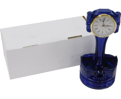 A Classic small block Chevy upcycled piston clock, in a candy blue powder coating, foot with quartz movement, boxed, 22cm hig