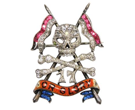A 17th Lancers silver paste and enamel brooch, with crossed pennants, skull, crossbones, and banner motto 'For Glory', stampe