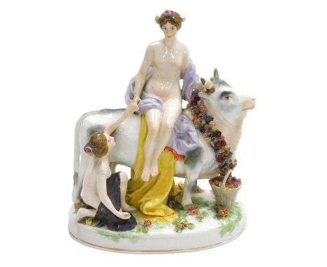 A 20thC Dresden porcelain figure group, of Europa and the bull, Europa modelled seated upon the bull's back, with an attendan