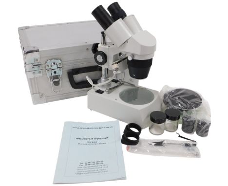A Brunel microscope, MX/DM2, stereo microscope series, cased with instructions.