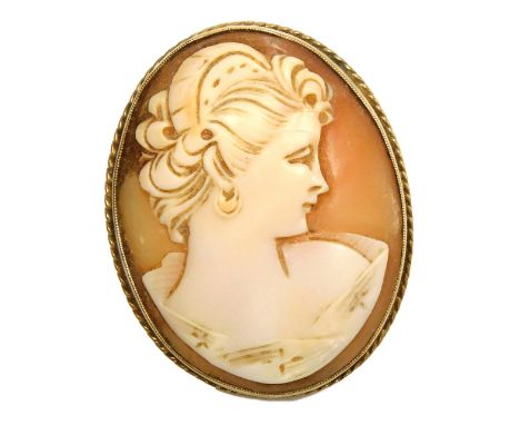 A 9ct gold and shell cameo brooch, bust portrait of a lady, 9.3oz all in.