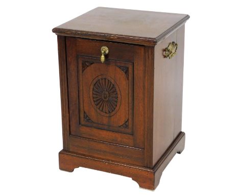 A late Victorian walnut coal purdonium, the square top with a moulded edge above a carved panel door, single brass handle, on