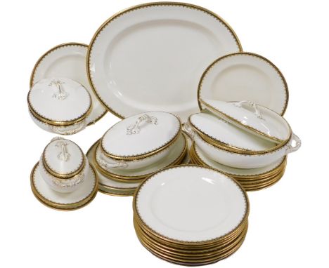 An early 20thC Cauldon porcelain dinner service, retailed by T. Goode &amp; Co, South Audley St., London, with a cobalt blue 
