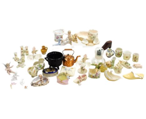 A group of late 19thC continental porcelain novelty ornaments, including broken shell and bird, spill vases, envelope and sea