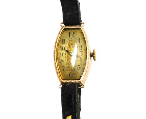 A mid Century lady's 9ct rose gold cased wristwatch, oblong champagne dial bearing Arabic numerals, plain case, on a leather 
