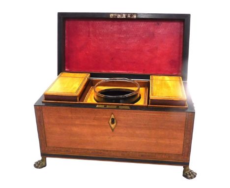 A George III satinwood tea caddy, with cross banding, twin lion's head and ring handles, the hinged lid opening to reveal a f