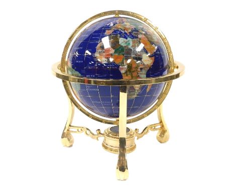 A terrestrial hardstone globe, in a brass gimbal frame, frame 29cm wide.