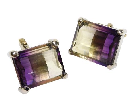 A pair of ametrine cufflinks, the faceted, curved stones, in white metal box claw mounts.