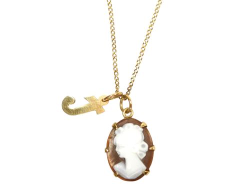 A 9ct gold and shell cameo pendant, bust portrait of a lady, together with an initial 'j' pendant, yellow metal, stamped 9ct,
