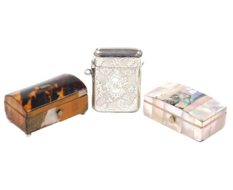 A 19thC mother-of-pearl bound miniature casket, 6cm wide, tortoiseshell casket, raised on four white porcelain ball feet, 6cm
