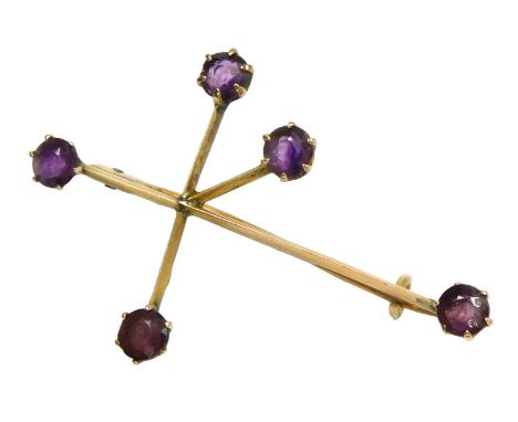 An amethyst set abstract pendant cross, in yellow metal, stamped 9, 2.3g.