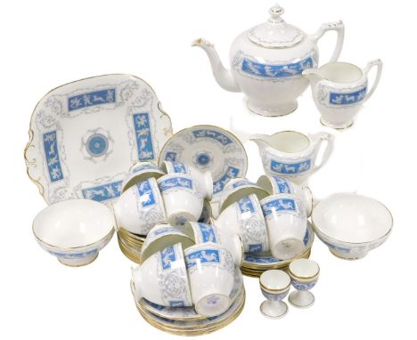 A Coalport porcelain Revelry pattern tea service, comprising teapot, a pair of sugar bowls, and cream jugs, bread plate, twel