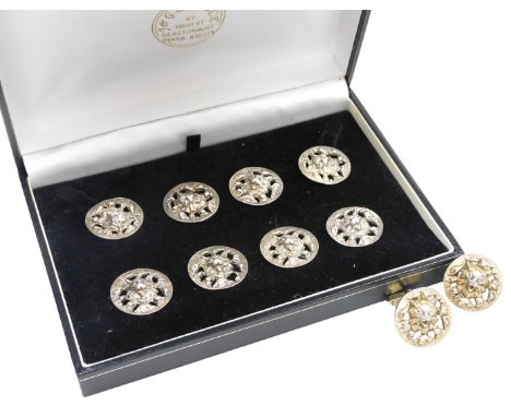 A set of eight dress buttons and a pair of cufflinks, of circular form, embossed with the head of a Louis Wain style cat, whi