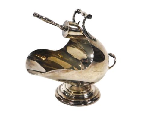A Mappin &amp; Webb silver plated sugar scuttle, of helmet form, with a sugar shovel, impressed Princes Plate marks.