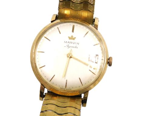 A Marvin Agenda gentleman's 9ct gold cased wristwatch, circular champagne dial with gold markers, centre seconds, date apertu