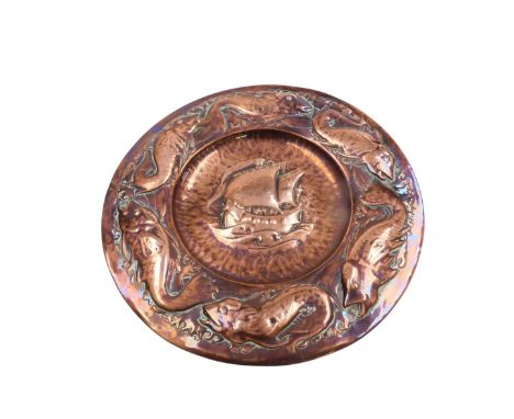 A late 19thC Newlyn School Arts &amp; Crafts copper charger, by Philip Hodder and John Drew MacKenzie, embossed centrally wit