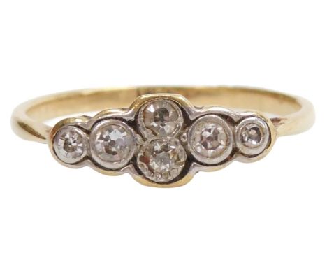 An Art Deco diamond ring, set with six brilliant cut diamonds, in yellow metal, stamped 18ct, size M 1/2, 1.6g.