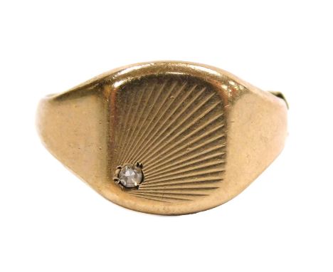A 9ct gold gentleman's signet ring, with a tiny diamond set to the square head, size S 1/2, 5.8g.