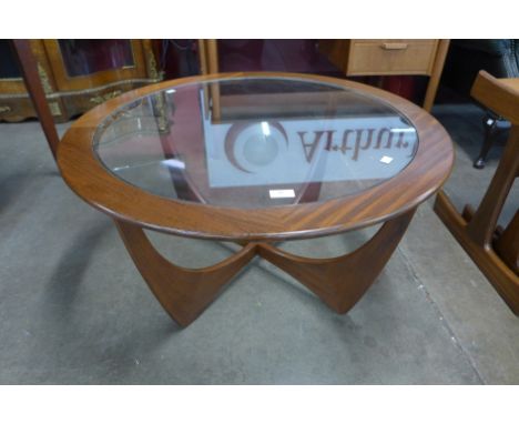 A G-Plan Astro teak and glass topped circular coffee table 