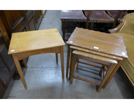 A Cotswold School oak nest of tables and an occasional table 