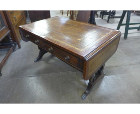 A Regency style mahogany and green leather topped drop-leaf coffee table 