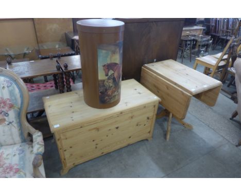 A pine blanket box, a pine drop leaf table and a storage box 