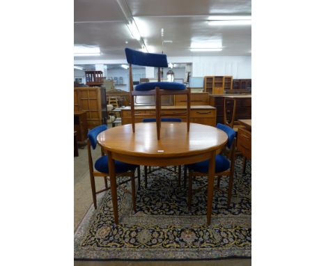 A G-Plan Fresco teak circular extending dining table and four chairs 