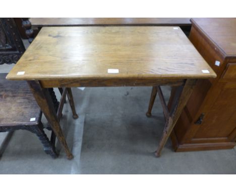 An Arts and Crafts oak occasional table 