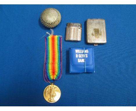 A First World War victory medal, to Pte. W. E. Crundell, A. S. C., and a selection of oddments, including lighter, coins, etc