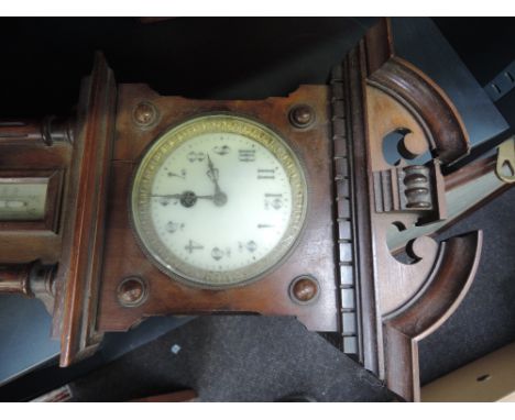 An Edwardian stained frame wall clock/barometer in architectural case having aneroid movement and thermometer 