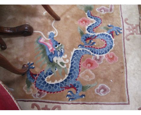 A carpet square of Chinese design having mustard ground and typical mythological decoration
CONDITION REPORT, modern but in u