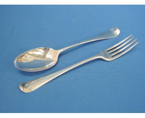 A Georgian silver tablespoon, London, date mark worn, makers mark JJ possibly James Jones and a Georgian silver table fork, L