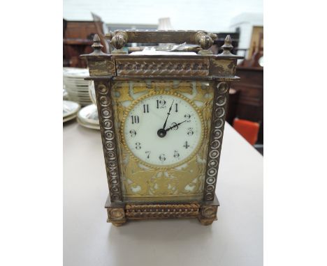 A 19th century brass carriage clock having fretwork decoration and French movememt
CONDITION REPORT, We do not test for funct
