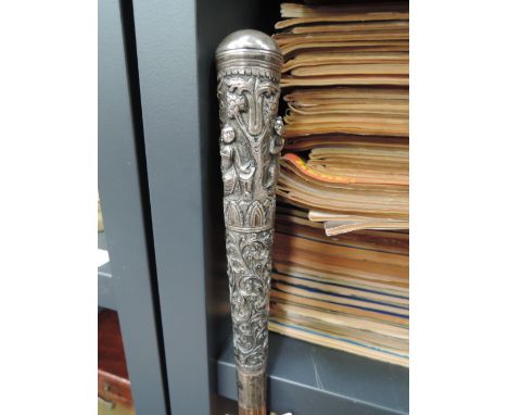 A 19th century swagger stick/walking cane having white metal Indian embossed top and coromandel shaft
CONDITION REPORT,  ther