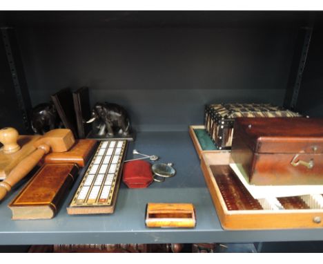 A selection of miscellaneous including treen, elephant bookends, cribbage board, hat pins, Srilankan quill box, optical box e