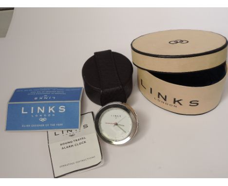 A Links of London white dial travel alarm clock in leather case with original box