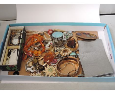 A selection of costume jewellery including amber style beads, brooches, earrings, rolled gold bangle etc, and two steel cigar