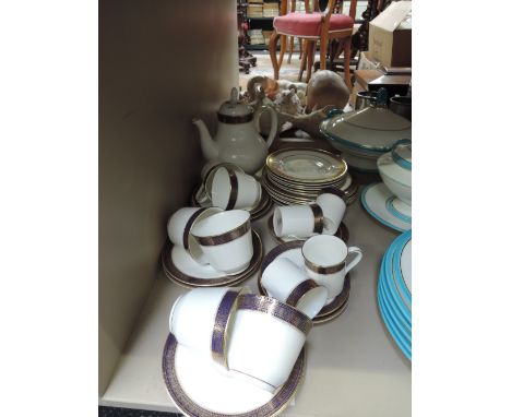 A Royal Doulton tea/coffee service in the gilt heightened Rachelle pattern