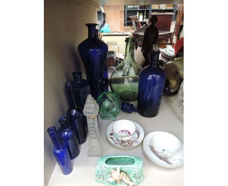 A selection of ceramics and glassware including blue glass and two 19th century tea cups and saucers, Augustus Rex inspired a