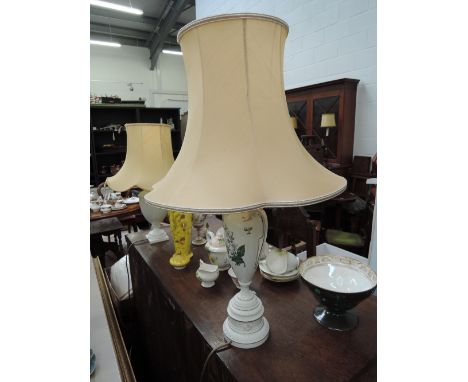 A Royal Worcester table lamp having foliate decoration and a table lamp of blanc de chein urn form